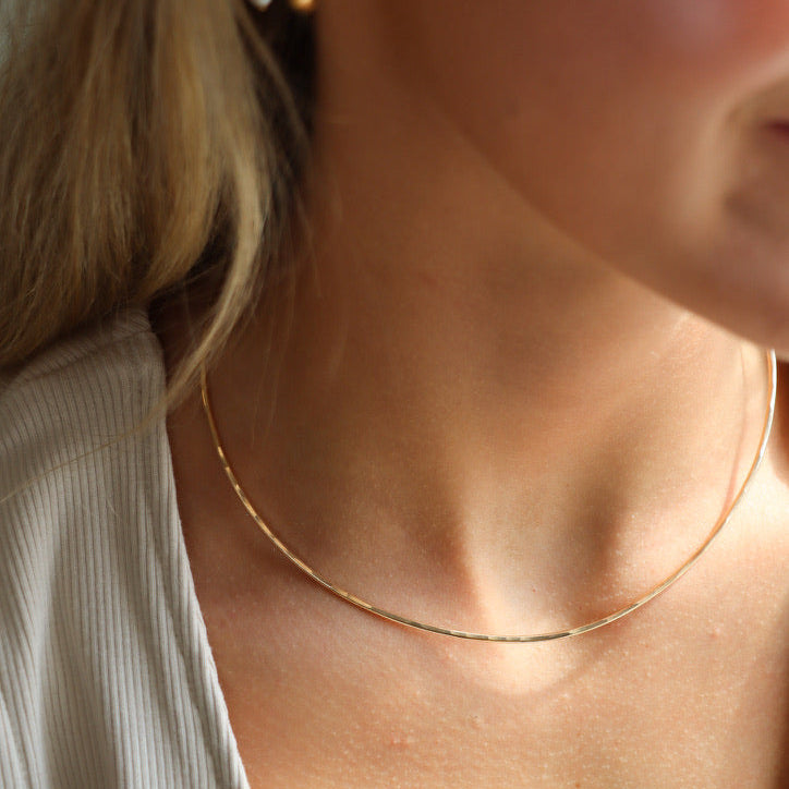 model wearing 14k gold fill hammered wire necklace