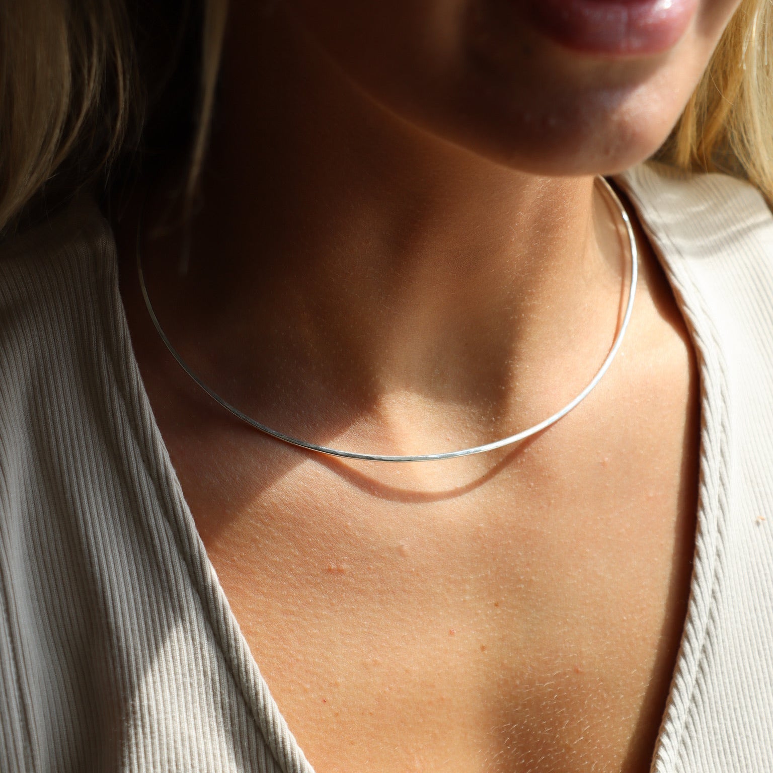 model wearing sterling silver hammered wire necklace