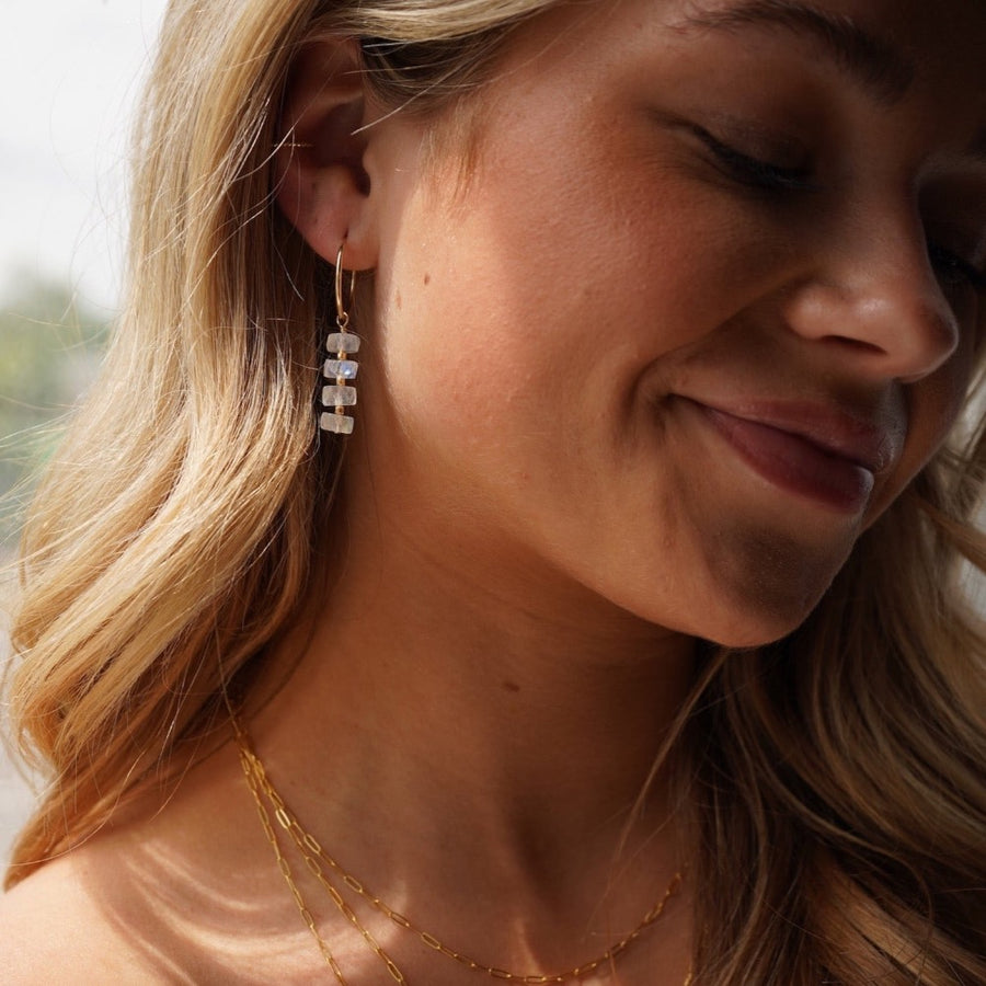 Model wearing 14k gold fill Selene Hoops, These Earrings feature our 16mm Goldie hoops along with 4 Moonstone Faceted gemstones stacked onto of each other