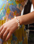 Model wearing 14k gold fill Pearl Petals Bracelet