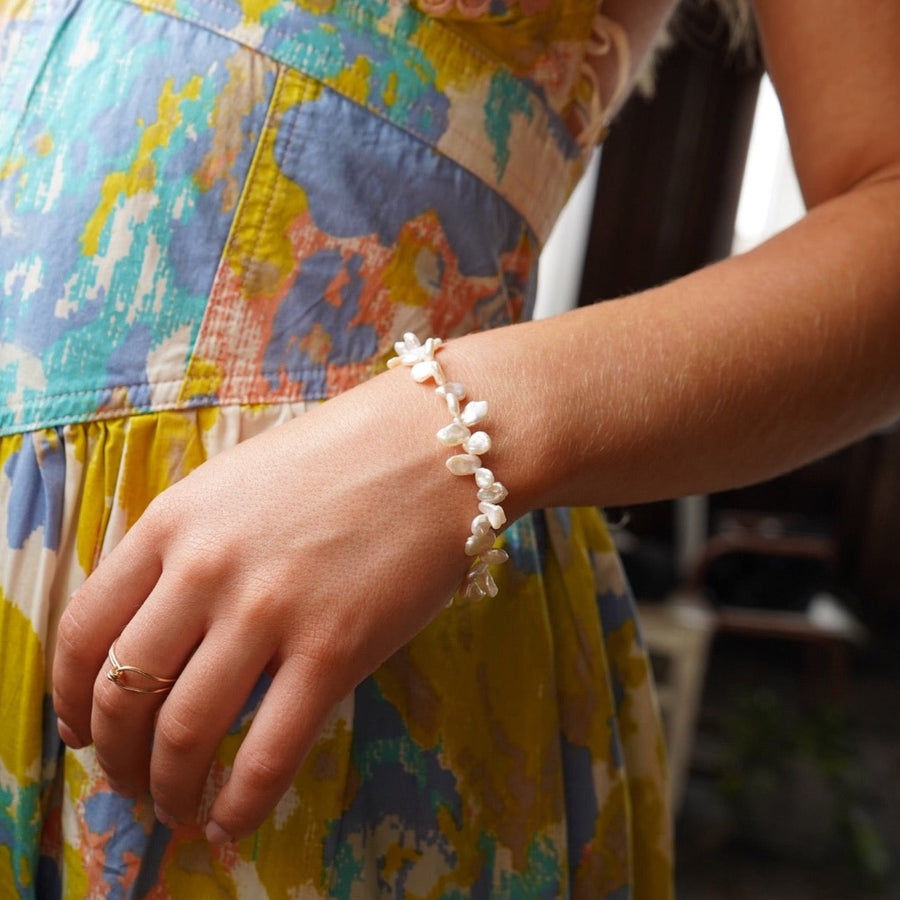 Model wearing 14k gold fill Pearl Petals Bracelet