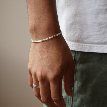 Model wearing 925 sterling silver mens cater bracelet