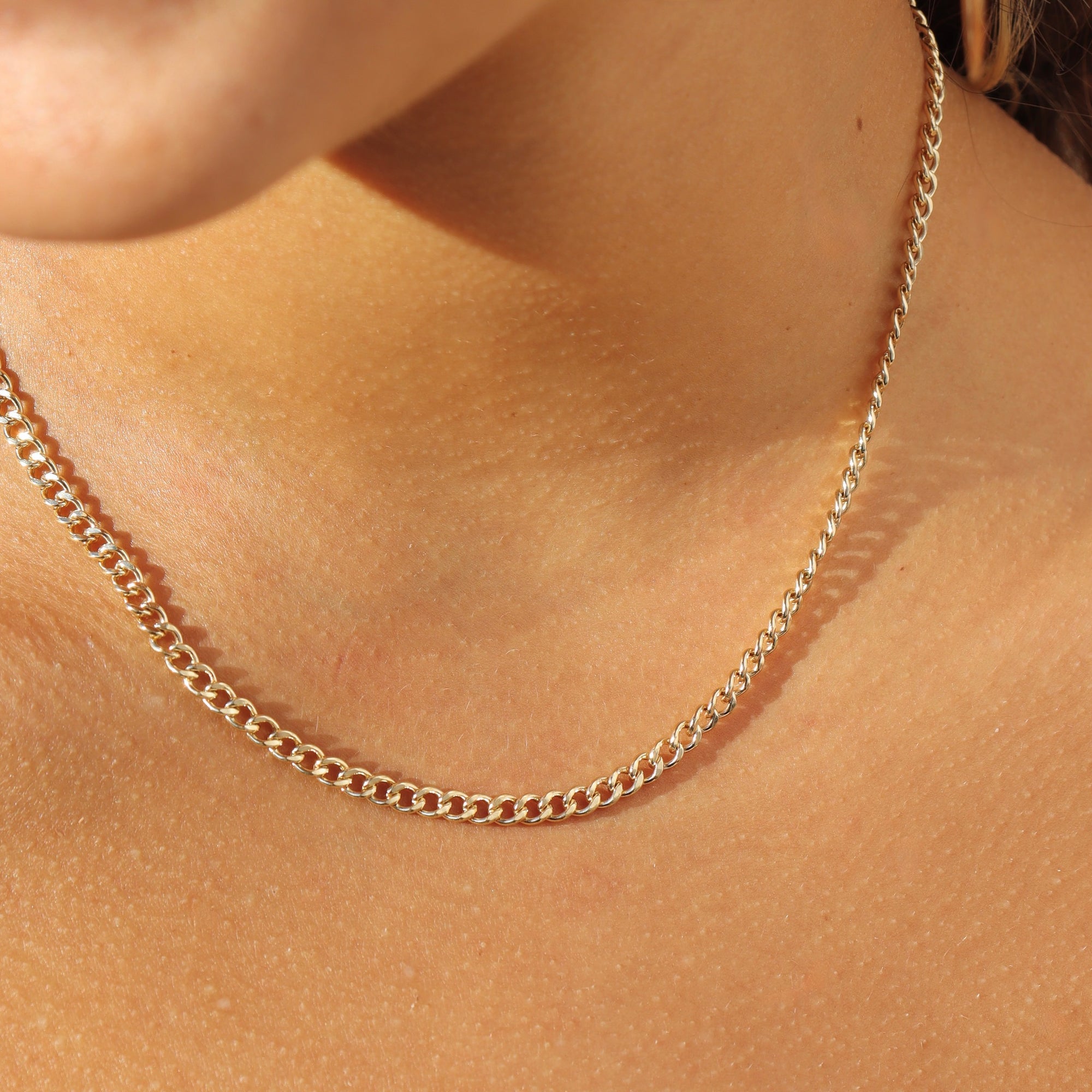 model wearing 14k gold fill curb chain 