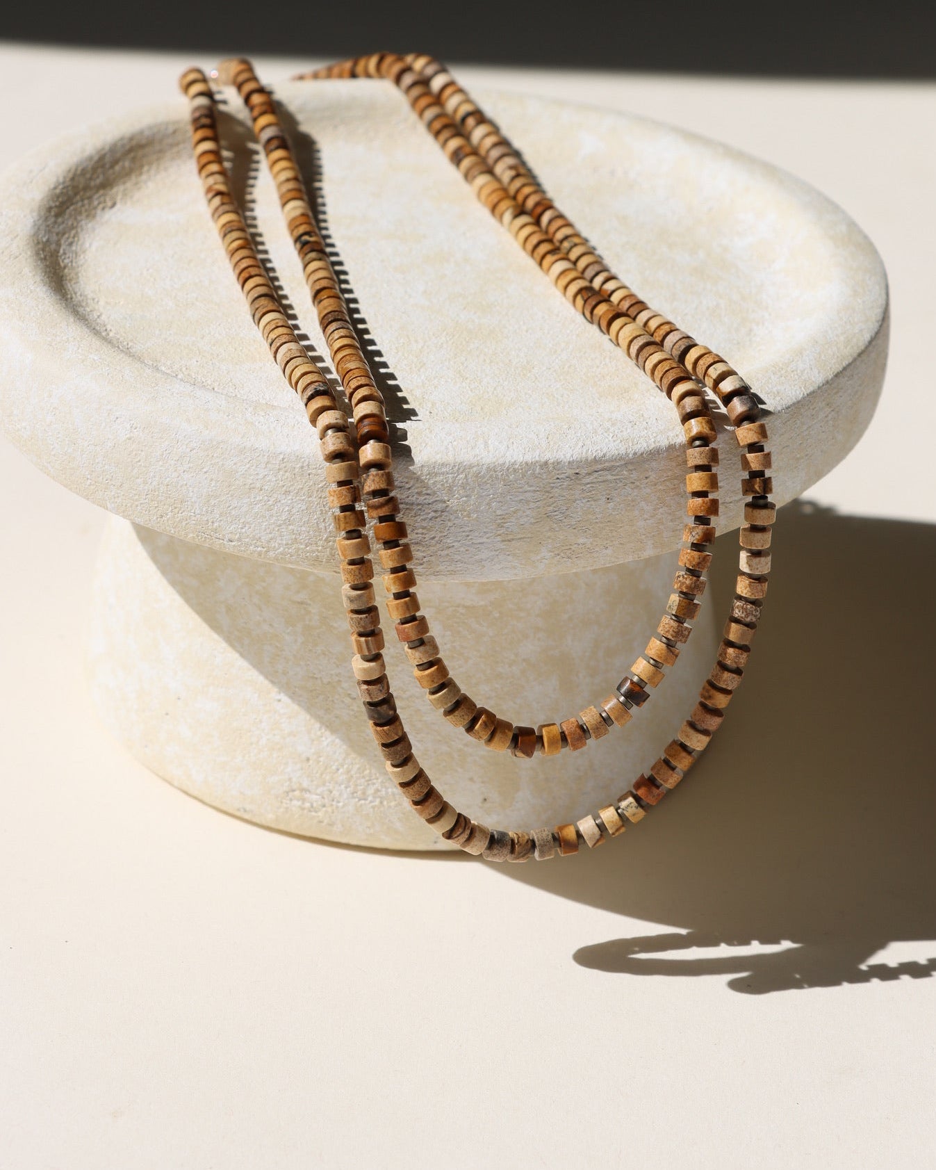 jasper beaded necklace laid in the sunlight