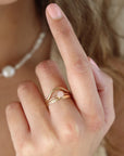 Rose Quartz Ring in 14k gold fill on model and stacked with other rings.