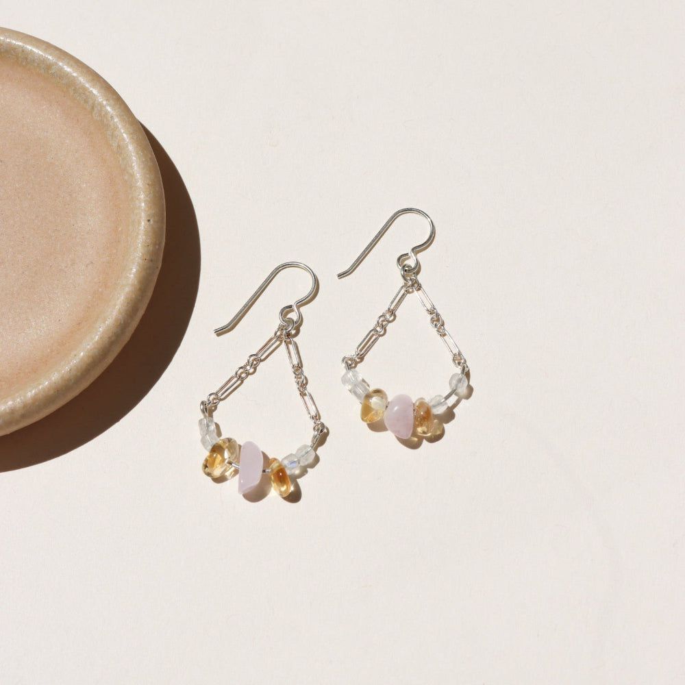 The Estella Earrings feature moonstone, kunzite, and citrine drops on a gold fill or sterling silver chain. Lightweight, feminine earrings with subtle movement.