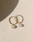 Faceted crystal hoop earrings in gold — elegant, lightweight hoops with sparkling crystal accents.