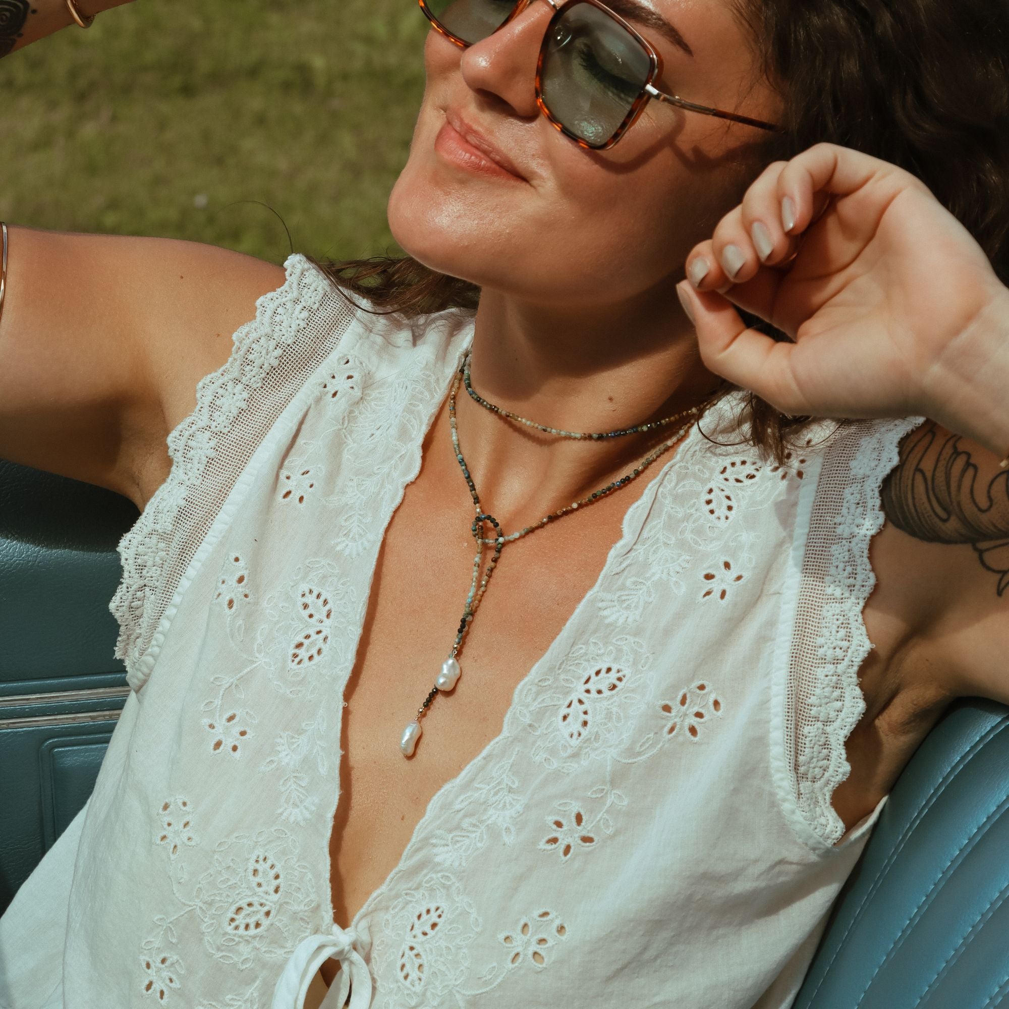 model wearing beaded wrap necklace