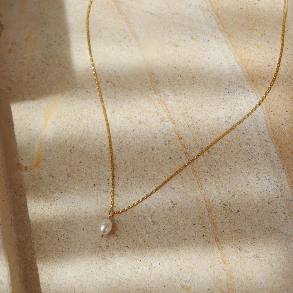 Featuring a delicate pearl and classic gold chain. Wedding Jewelry. Classic and Modern. Sterling Silver or 14k Gold Fill. Token Jewelry, handmade, hypoallergenic and waterproof.