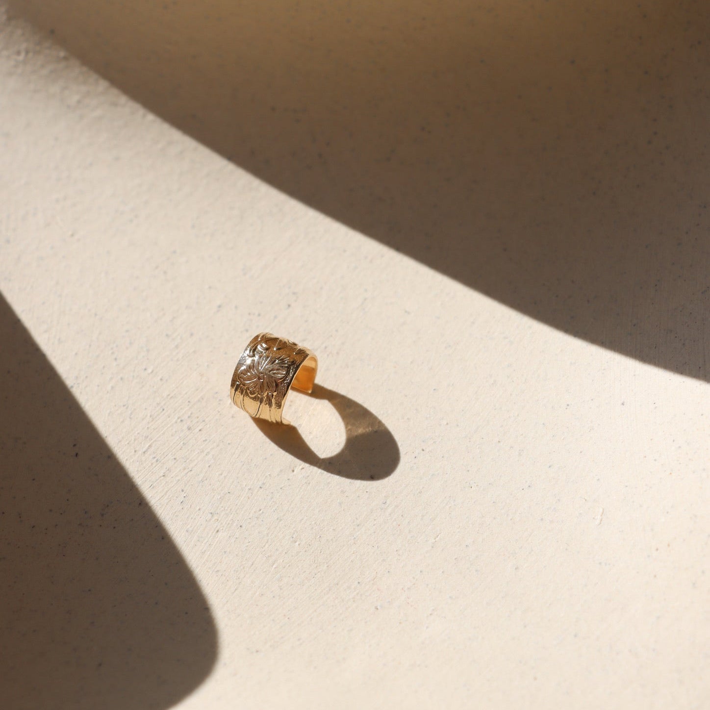 14k gold fill textured ear cuff in the sunlight