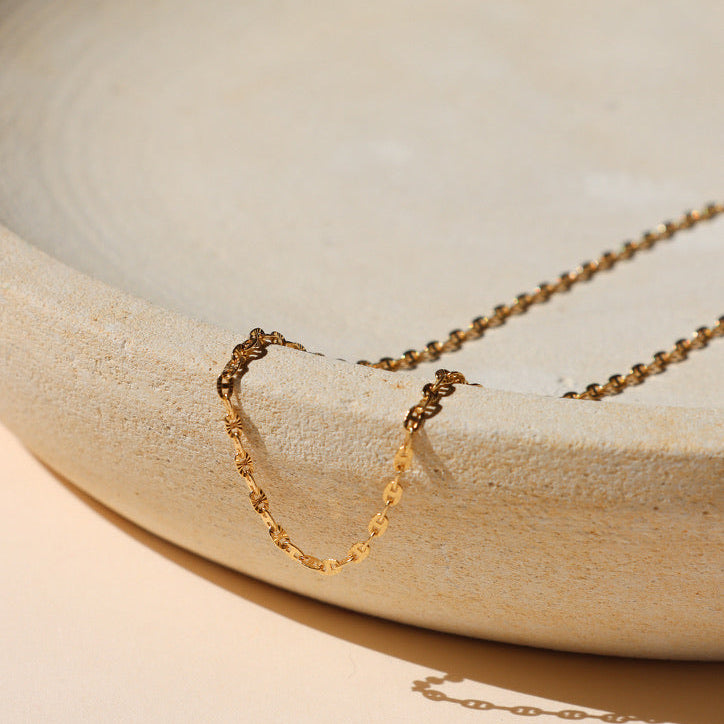 14k gold fill chain necklace on a light background