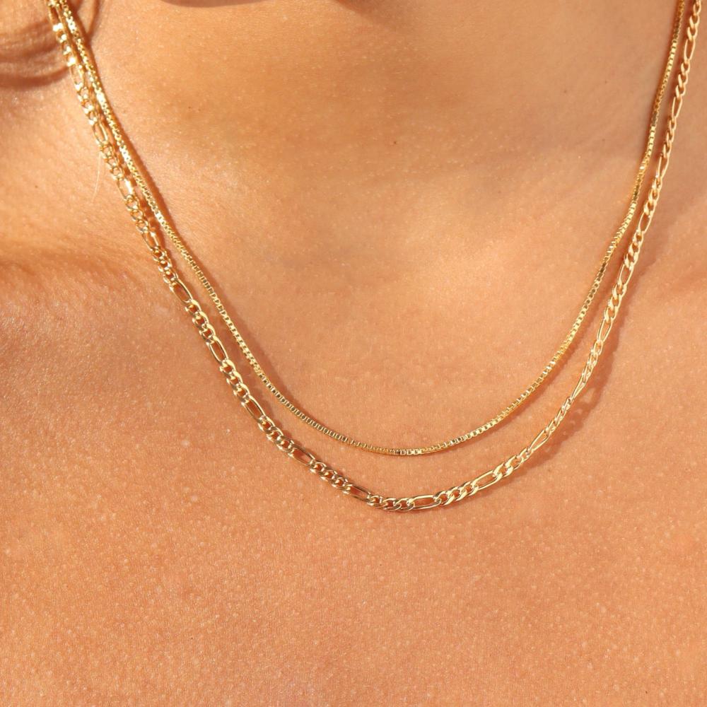 model wearing 2 14k gold fill chain necklaces