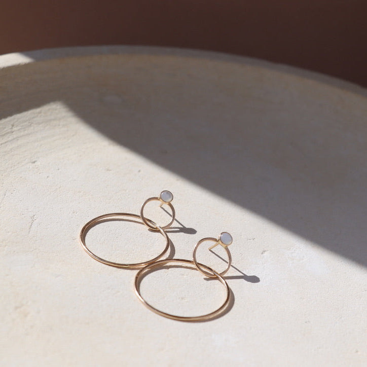 14k Gold fill stud earrings with handmade circle drops on a light background
