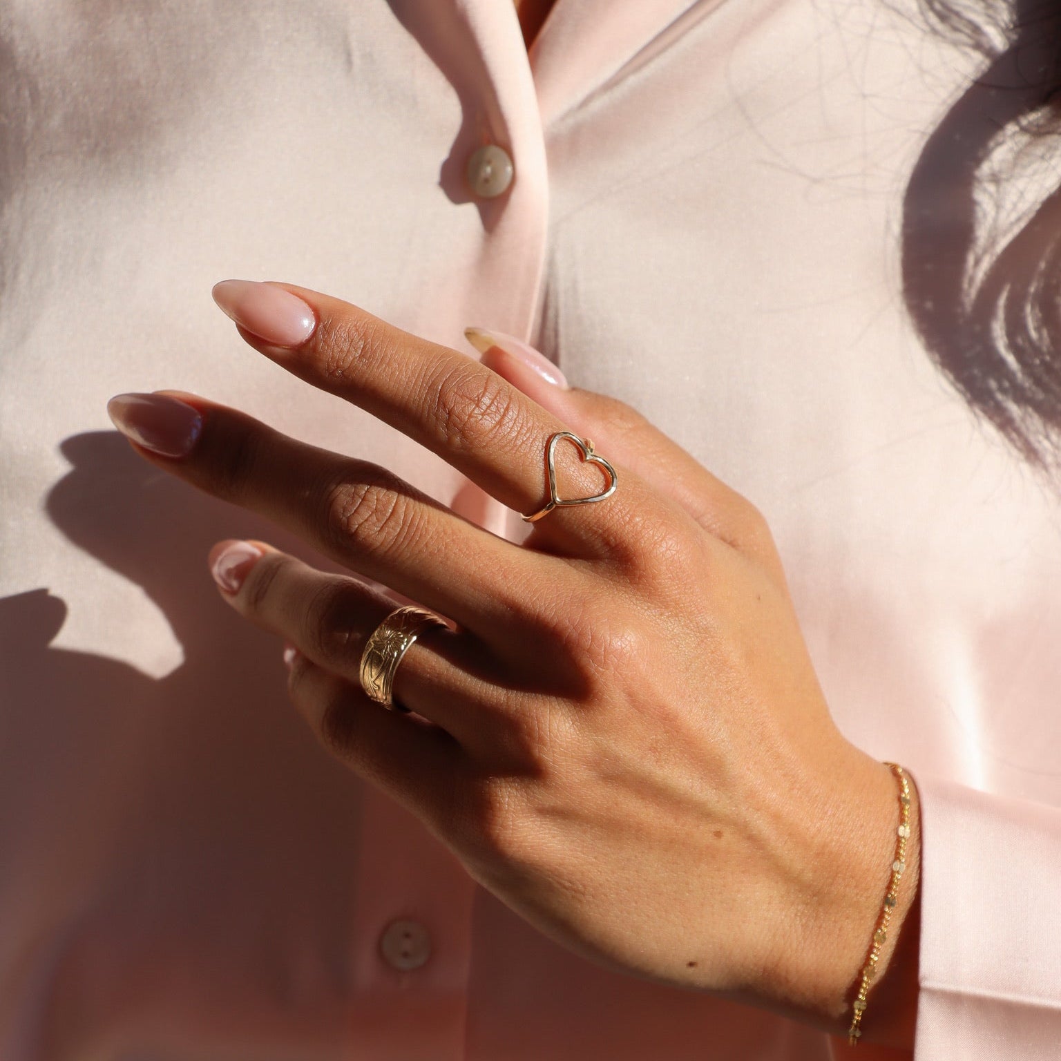 model wearing 14k gold fill heart ring 