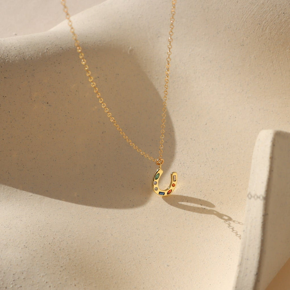 14k gold fill dainty chain with heavy gold plated horseshoe charm embellished with small stones