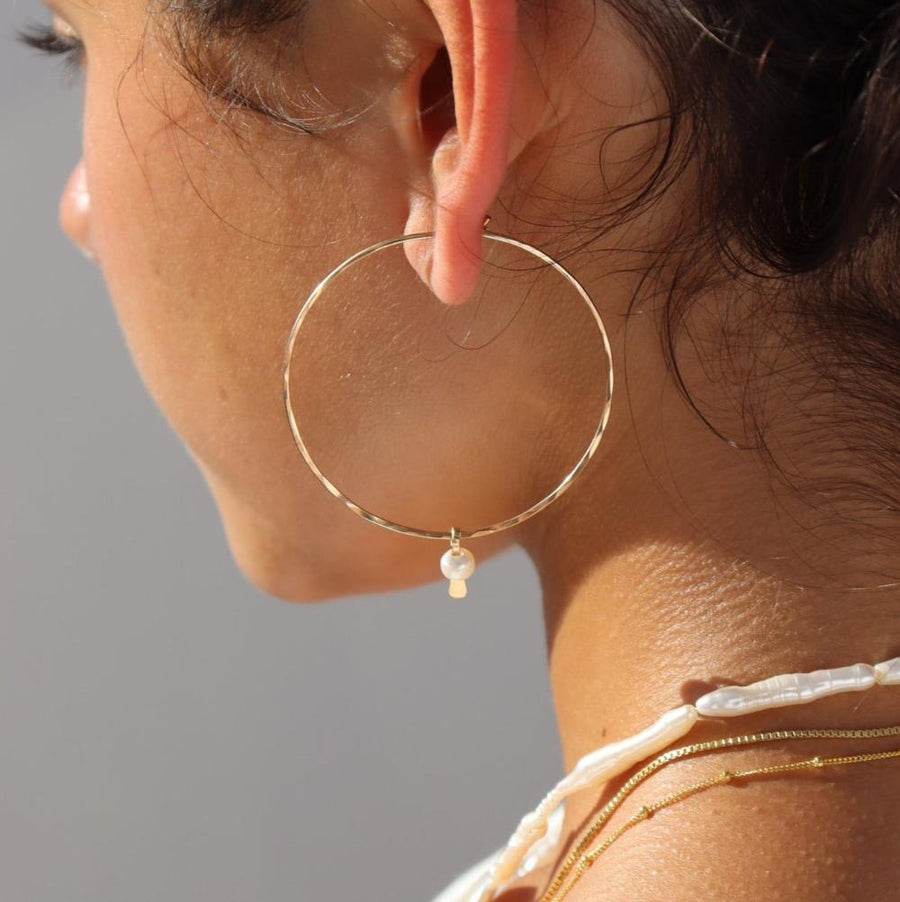 Model wearing 14k gold fill Emma pearl Hoops