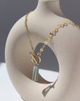 14k gold fill Flynn Toggle Necklace. This Necklace Features a Simple Toggle connector with a Dangle Fluorite tube gemstone . The toggle is held together with the Sylvie chain.