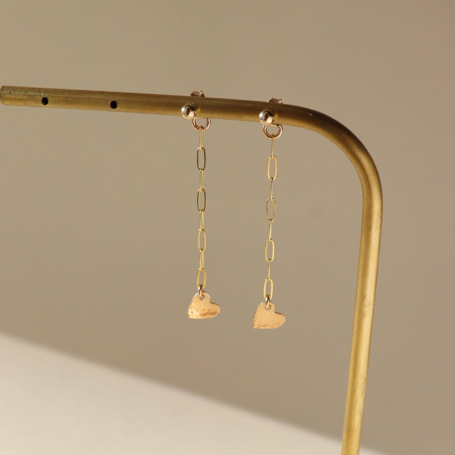 14k gold fill chain stud earring backs with a heart charm photographed on a bronze post