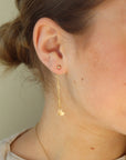 14k gold fill chain stud earring backs with a heart charm on a model