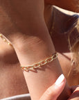 Model wearing 14k gold fill curve bracelet