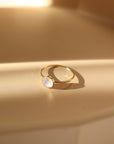 14k gold fill Moonstone Ring 6mm set on a peach plate. This plate features a simple band with a 6 mm bezel with the moonstone gemstone. - Token Jewelry