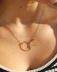 Model wearing 14k gold fill Unity Necklace.