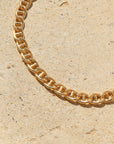 Marina Bracelet set out on a stoneware plate in the sun.