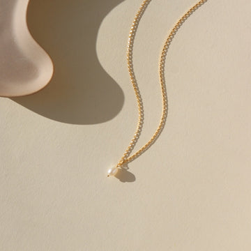 Featuring a delicate pearl and classic gold chain. Wedding Jewelry. Classic and Modern. Sterling Silver or 14k Gold Fill. Token Jewelry, handmade, hypoallergenic and waterproof.