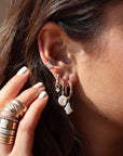 model wearing 14k gold keshi drop earrings.