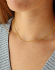 Model wearing 14k gold fill La Mer Chain - Token Jewelry