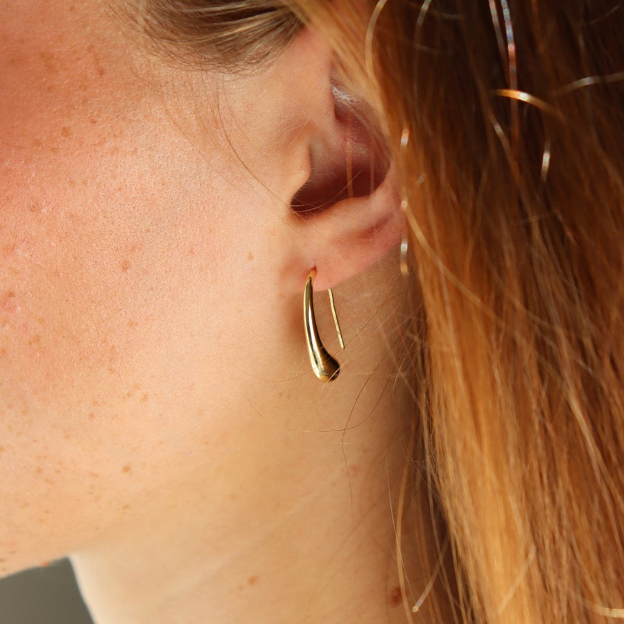 model wearing 14k gold fill Golden Drop Earrings - Token Jewelry