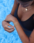 Model wearing 14k gold fill La mer Bracelet 
