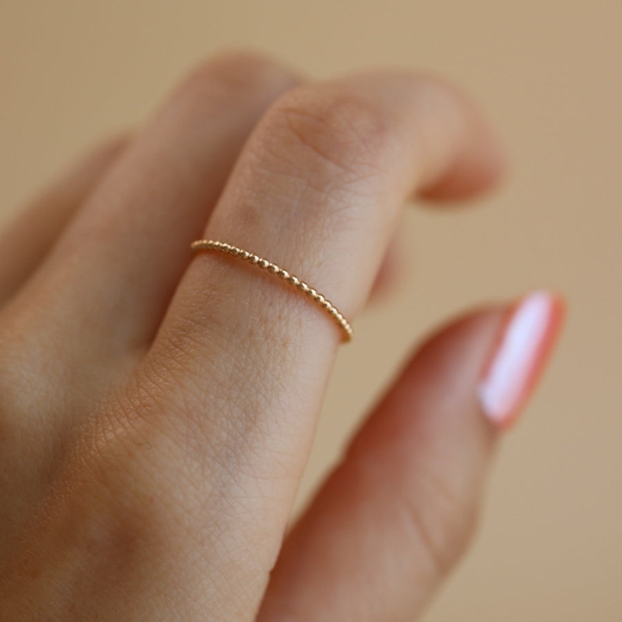 14k gold ring, gold ring, solid gold band, delicate beaded gold band, ring stack, handmade, heirloom collection, token jewelry, gold stacking ring, everyday jewelry, eau claire wisconsin, made in Wisconsin, made in the USA, handmade in eau claire wisconsin, woman owned business