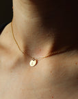 Model wearing Initial Coin Necklace 3/8"