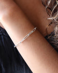 Model wearing 925 sterling silver China link bracelet