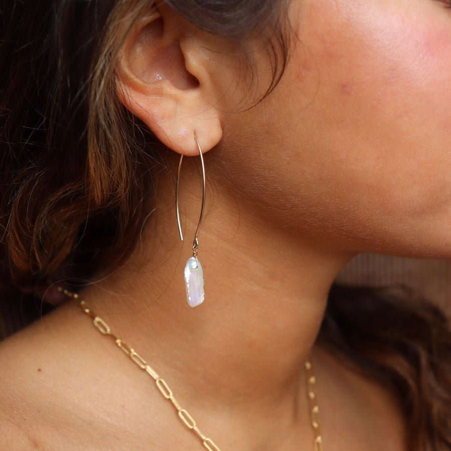 Model wearing 14k gold fill Juno earrings