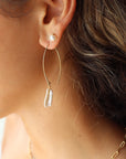 Model Wearing 14k gold fill Juno earrings pair with the pearl studs