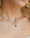 Model is wearing a 14k gold fill small rolo chain featuring a jade ball gemstone.