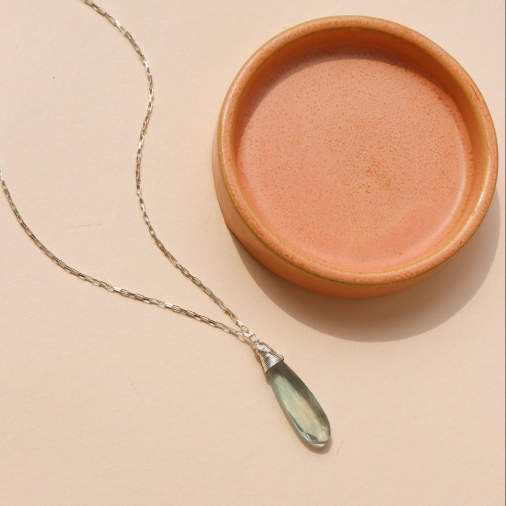 Laguna Pendant Necklace with faceted teardrop blue-green fluorite on petite sterling silver box chain, styled layered with other sparkly chains
