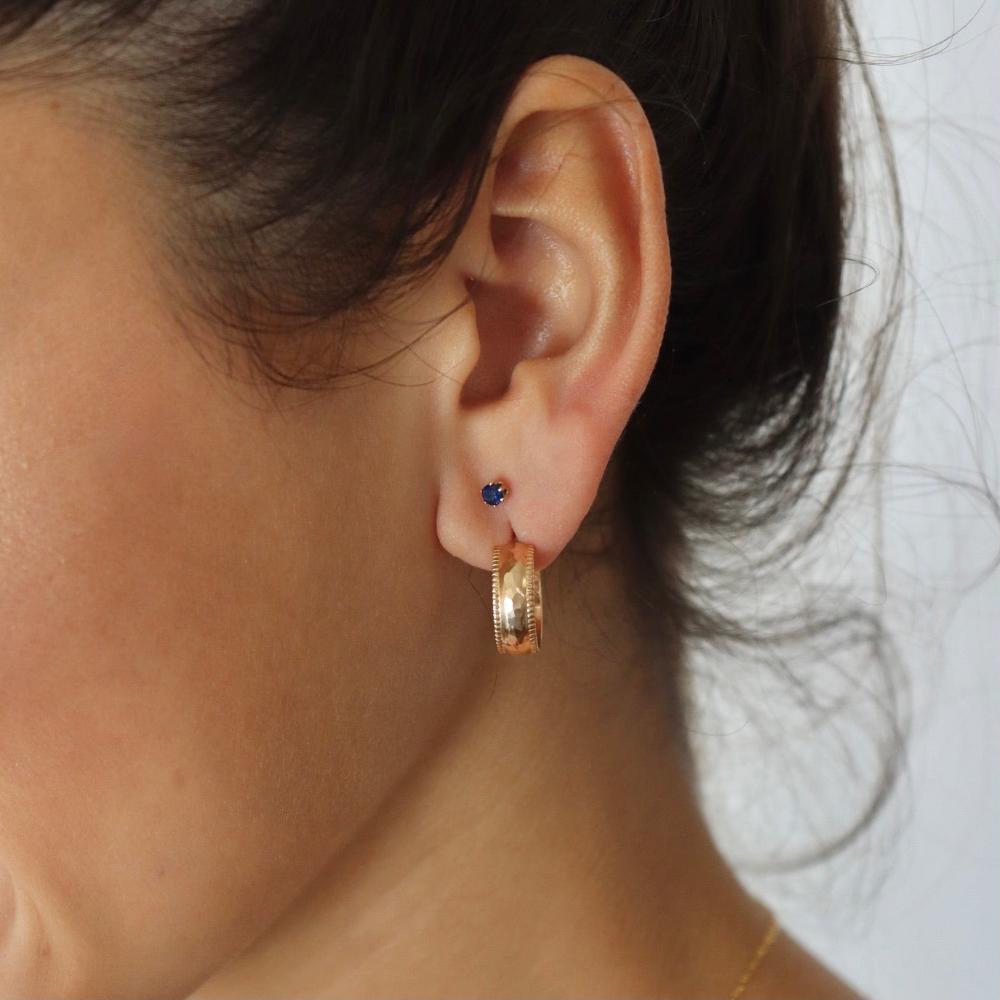 model wearing 14k gold fill hammered textured stud hoop earrings with stud gemstone earrings