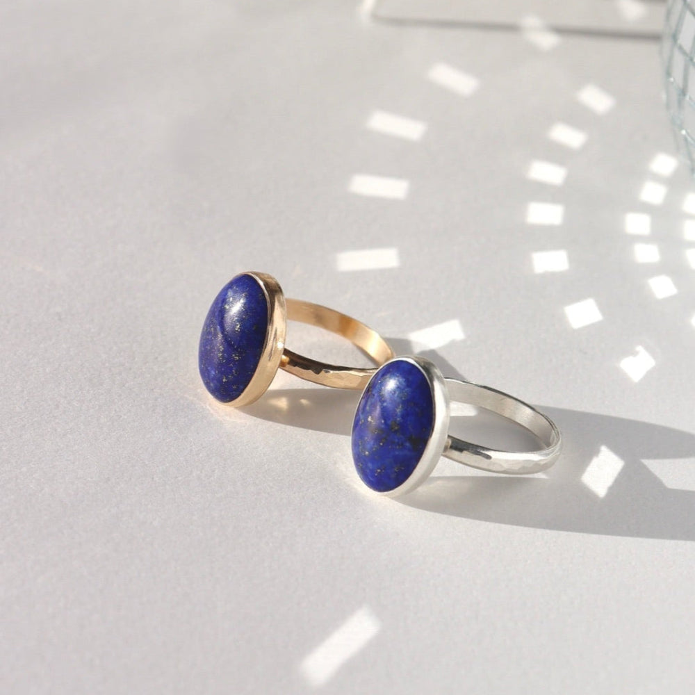 Lapis Lazuli Gemstone Ring in sterling silver and 14k gold fill, photographed on a white backdrop. 