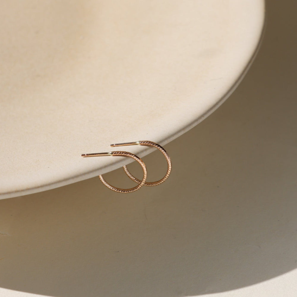 Lumen Hoops — 14K gold fill or sterling silver hoops with a sparkling wire. Lightweight, modern, and perfect for layering or wearing solo
