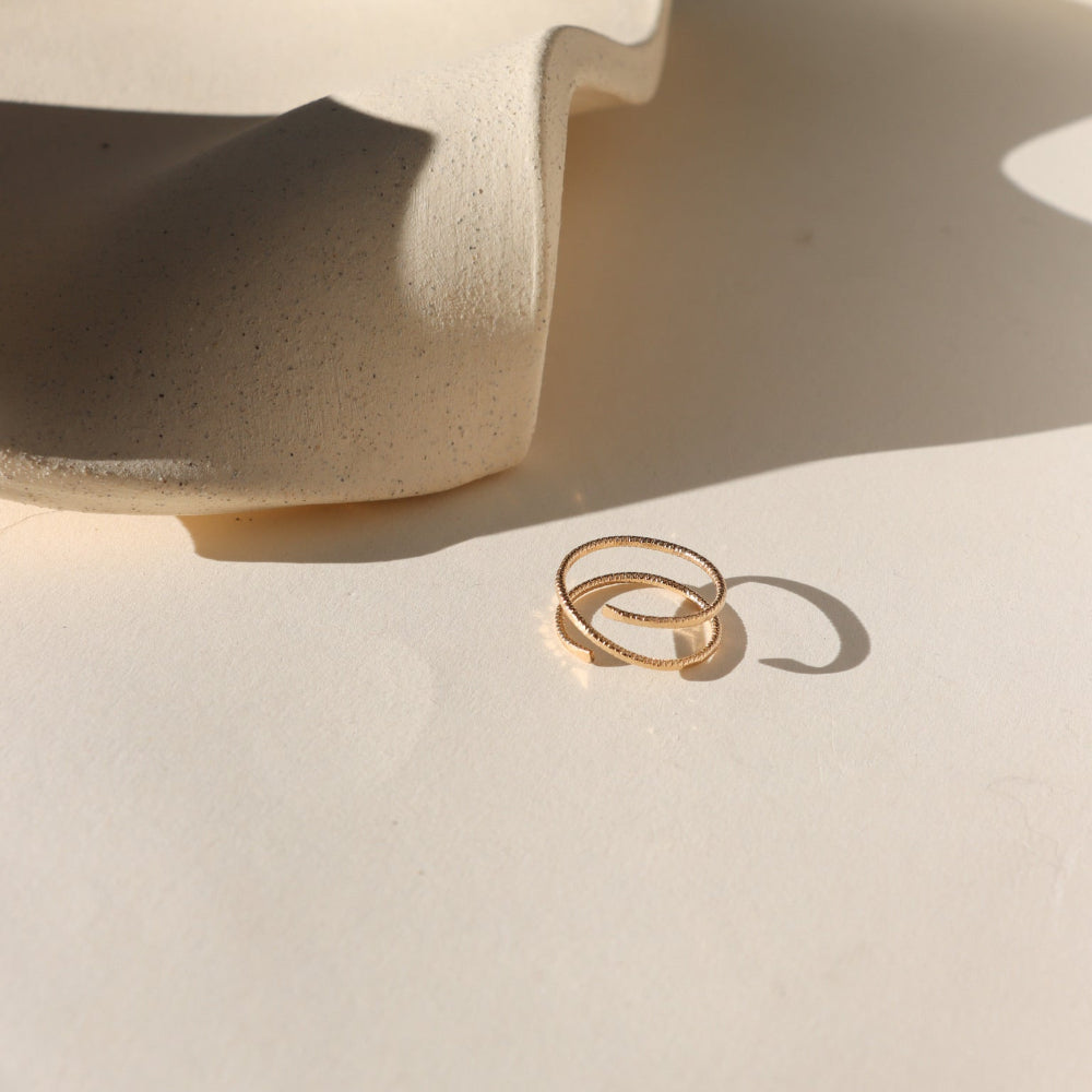 Lumen Ring handcrafted in 14k gold fill with a light-catching hammered texture.