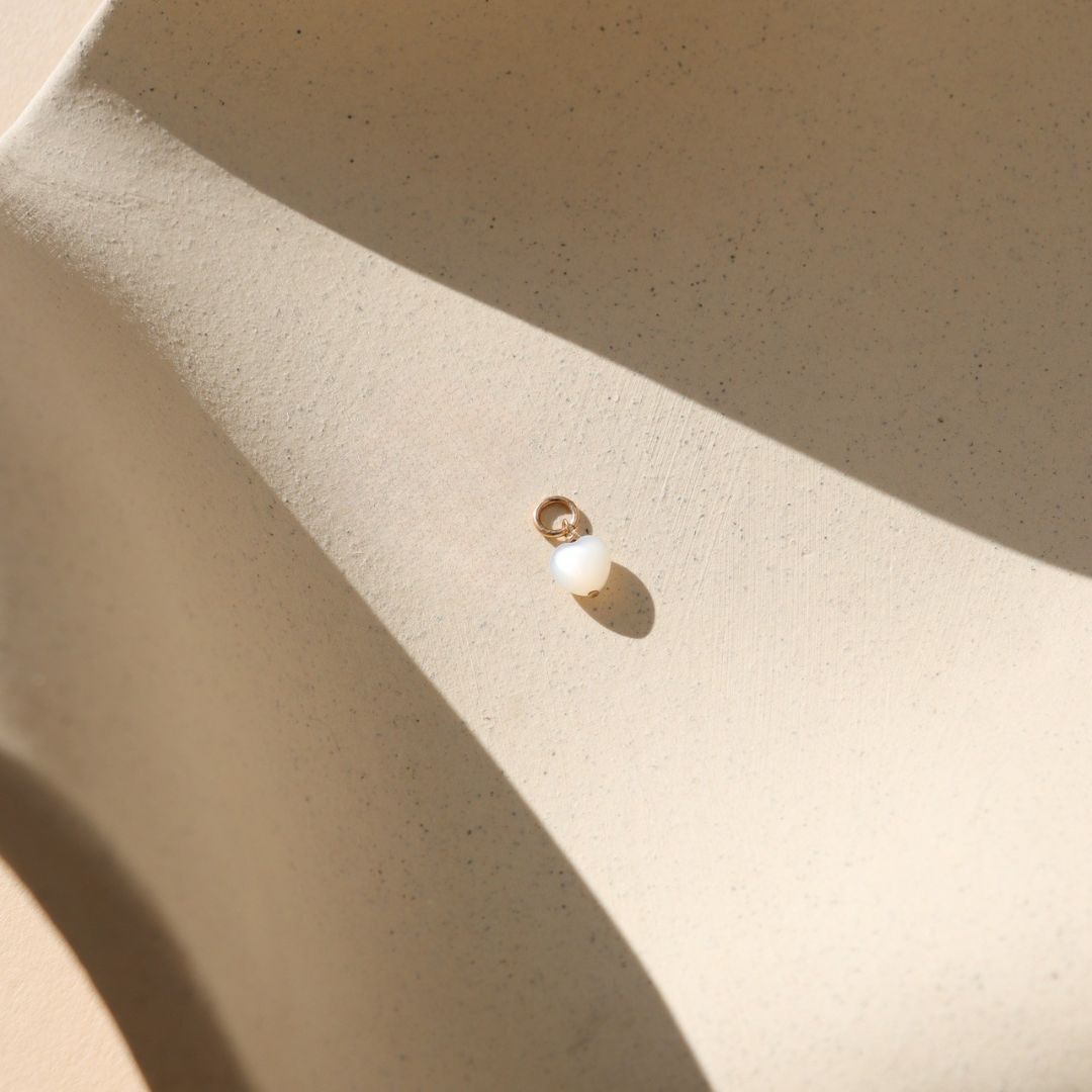 14k gold fill charm with mother of pearl heart bead