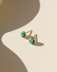 14k gold fill Malachite Studs placed in the sunlight. These Earrings feature Malachite gemstone.