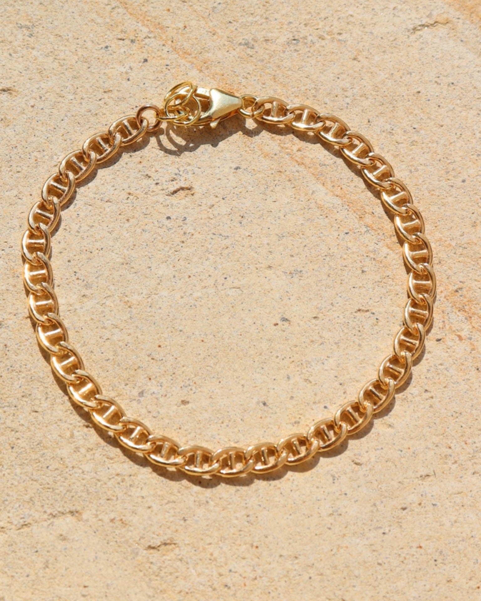 Marina Bracelet set out on a stoneware plate in the sun.