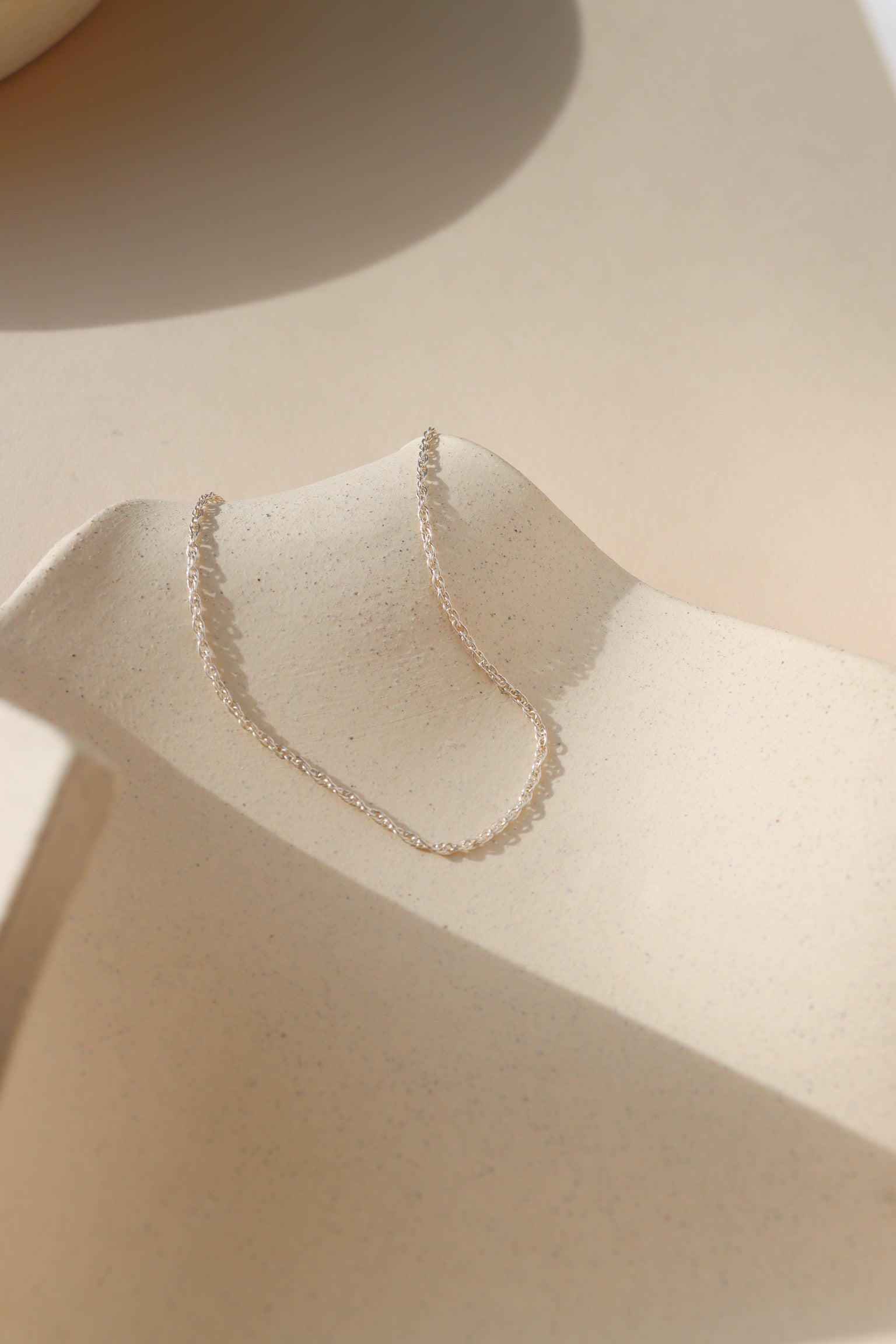 sterling silver chain necklace in the sunlight