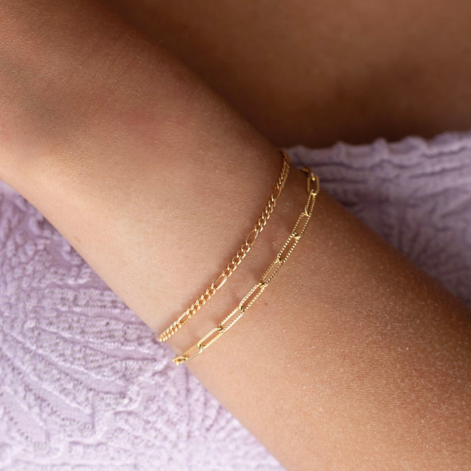 Capri Bracelet worn by a model and the piper bracelet both in 14k gold fill 