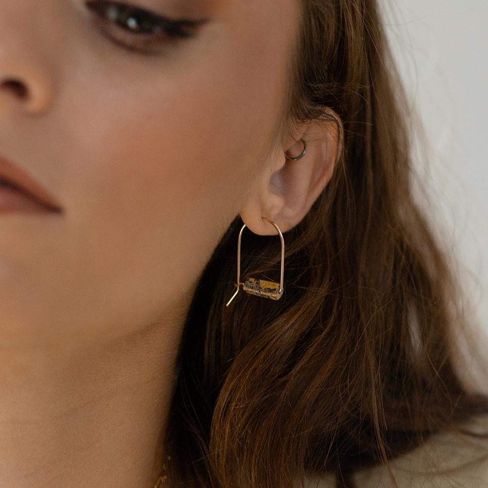 Model Wearing Leopard Skin Jasper Arches