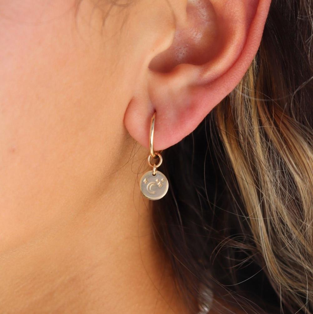 Model wearing 14k gold fill Starry Night Coin hoops